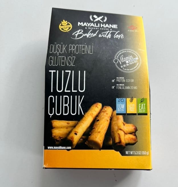 Box of Mayali Hane low-protein, gluten-free salted sticks with black and gold packaging.